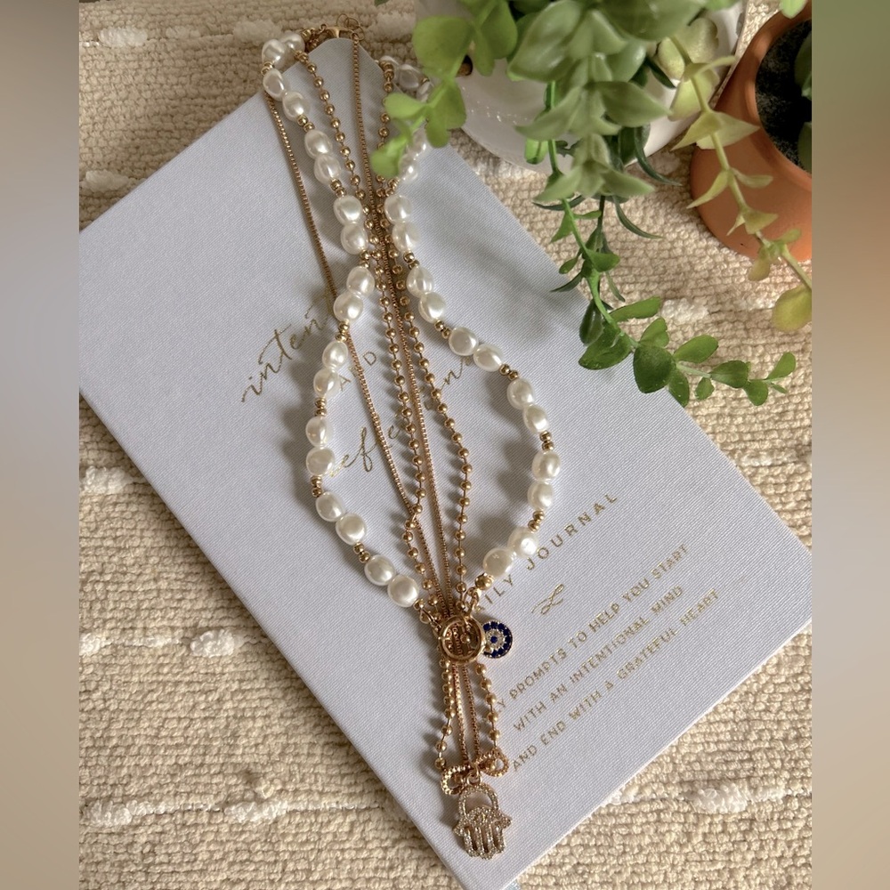 Gold Tone pearl and evil eye necklace